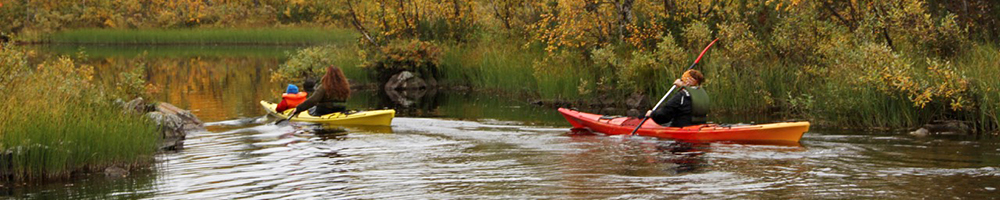 Family paddling a canoe together