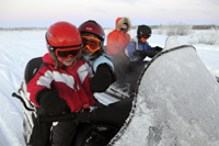 Snowmobiling during a winter adventure day