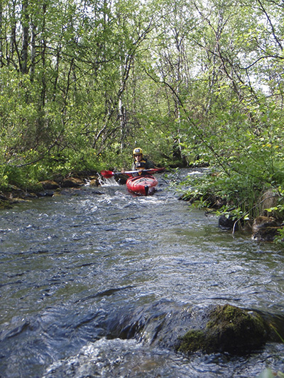 Negotiating a small rapid between the lakes