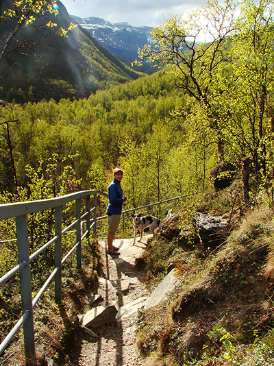 Mountain trekking past a waterfall in the Enontekiö fells